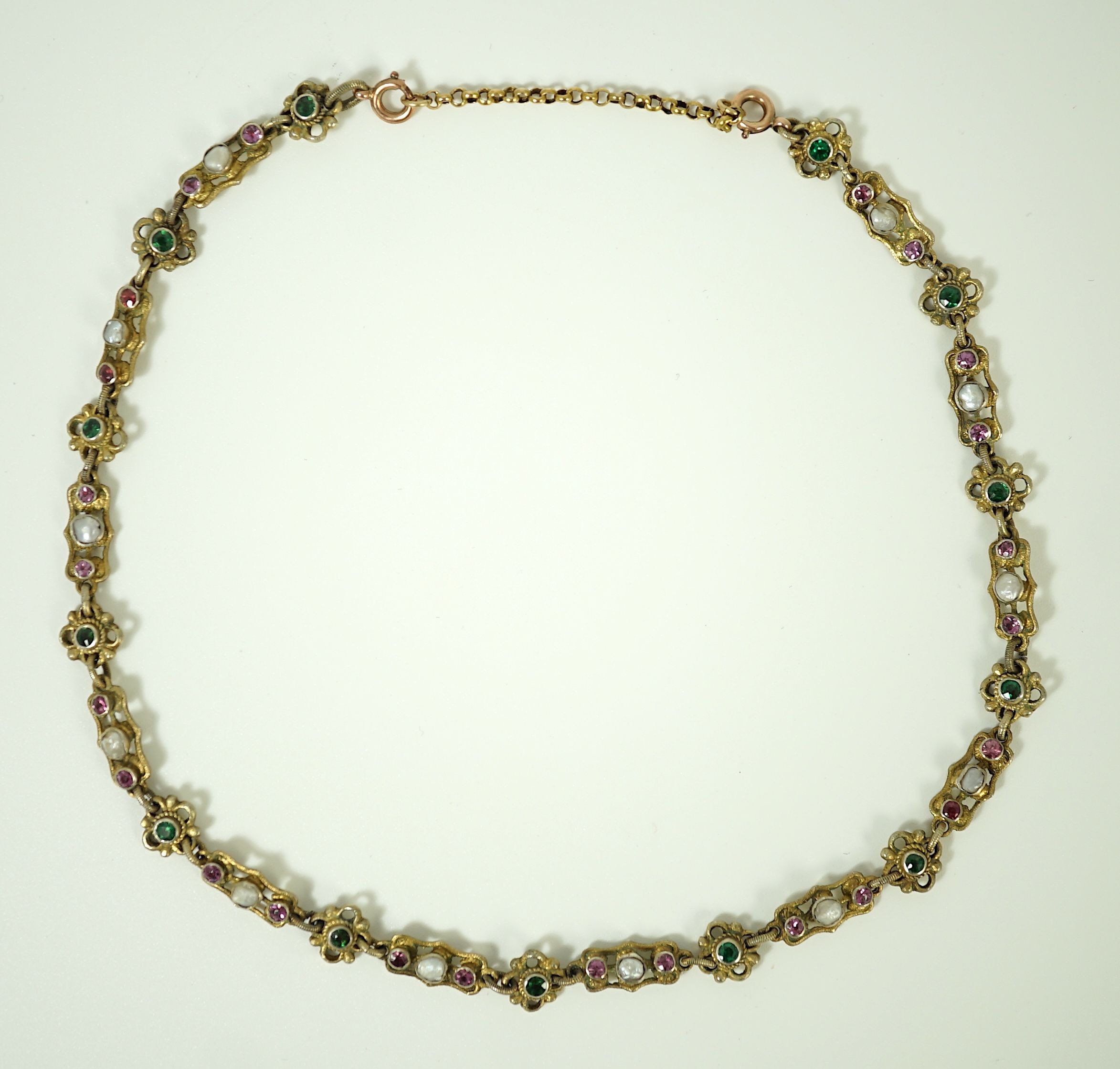 An early 20th century pierced and engraved silver gilt and gem set choker necklace, in the Suffragette colours